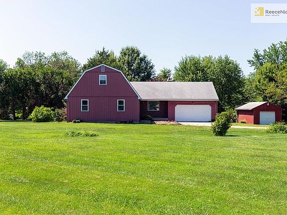 Enjoy 2.4 acres and TWO outbuildings!