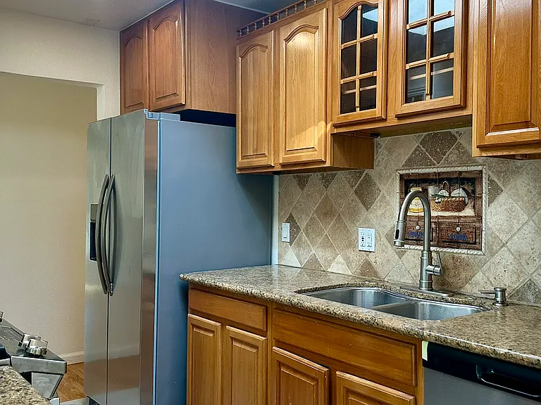 Kitchen with stainless steel appliances, recessed lighting, ample storage and skylight