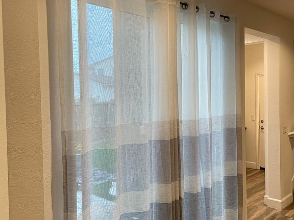 Kitchen has large patio-door access to yard (an additional patio-door access is available from living area)