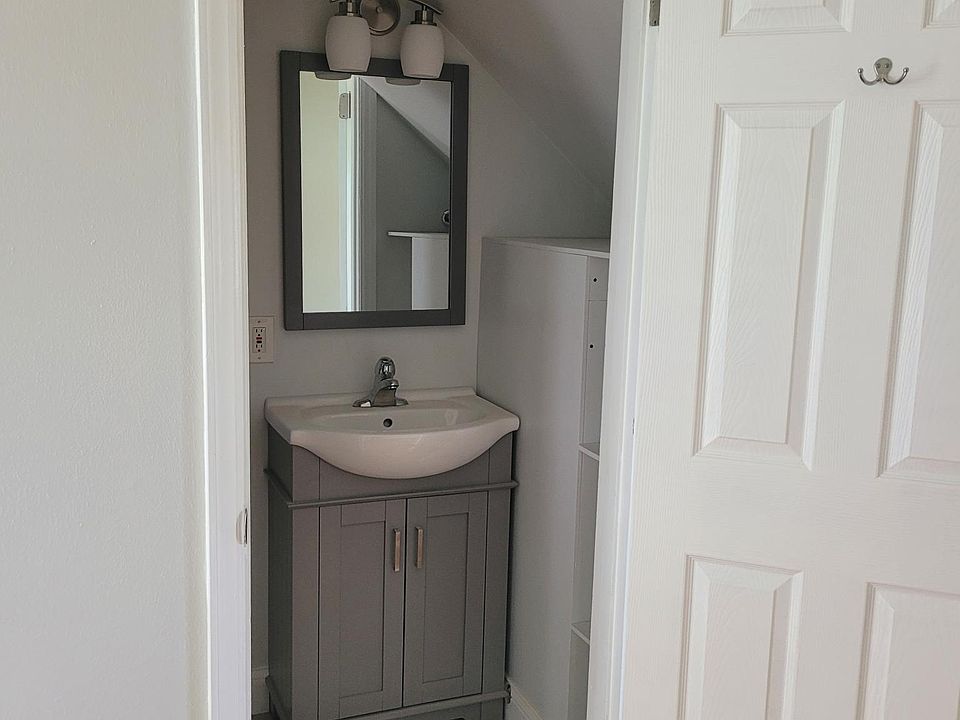 Upgraded half bath w/storage and new elongated toilet and fixtures