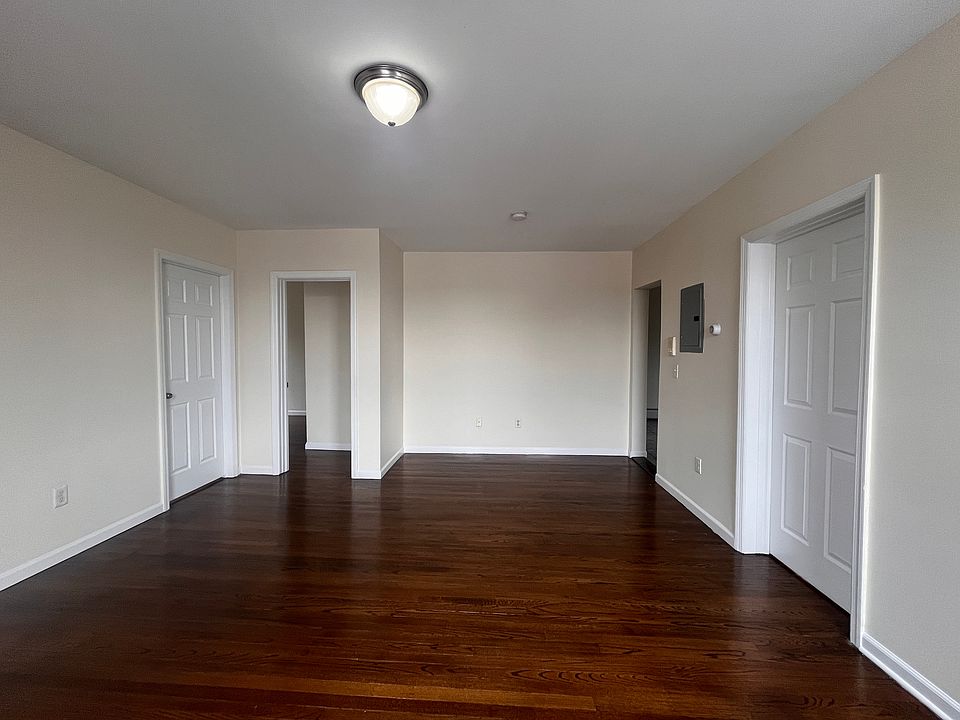 Living room w/ ample space for a dedicated dining area.