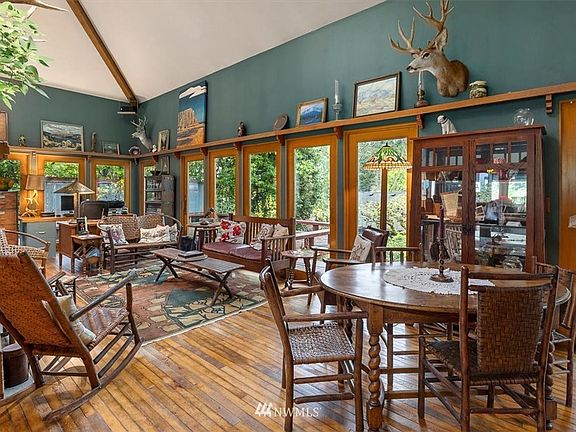 Room is surrounded by doors and windows that were reclaimed from a building in downtown Seattle.