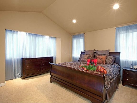 Large Master Suite has 5-piece bathroom, a walk-in closet & vaulted ceilings.