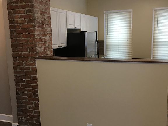 Exposed brick open kitchen