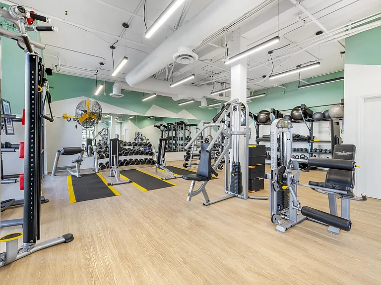 Full-length mirrors line the walls, allowing for perfect form checks and boosting confidence as you work toward your goals.