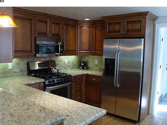 kitchen with laundry room; garage door and back door off Lau