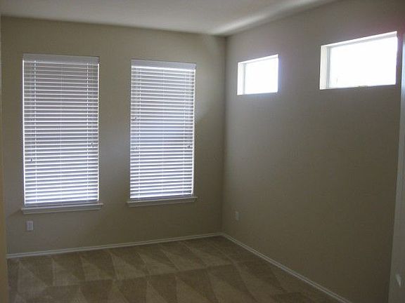 Accent windows add style. 2" faux wood blinds included