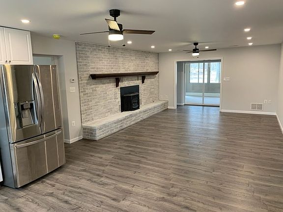 Open Airy Floor Plan Living Room with Pellet Stove to add ambiance to special evenings.