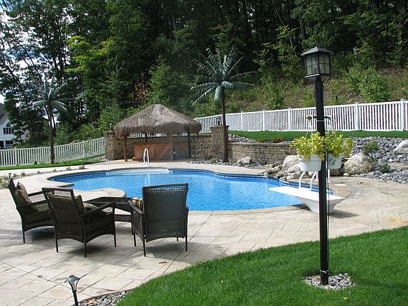 Inground Salt Water Pool with Waterfall, Tiki hut / Bar, Palm Trees