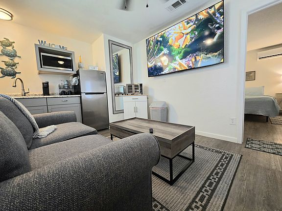 From the desk, loveseat, or kitchenette, enjoy a movie on the 60" Roku TV.