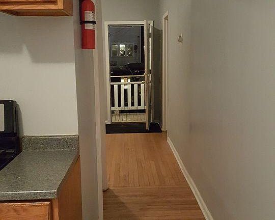 view of hardwood floors to back entry
