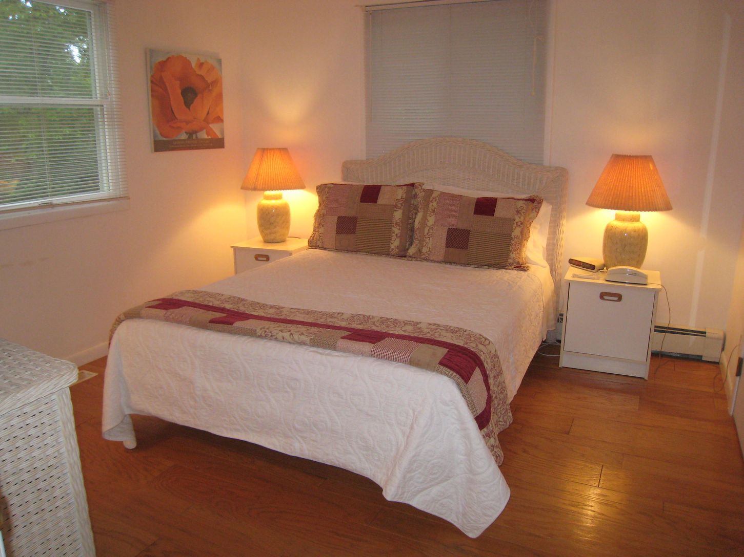  First floor bedroom with queen bed, flat screen tv, and adjoining bathroom.