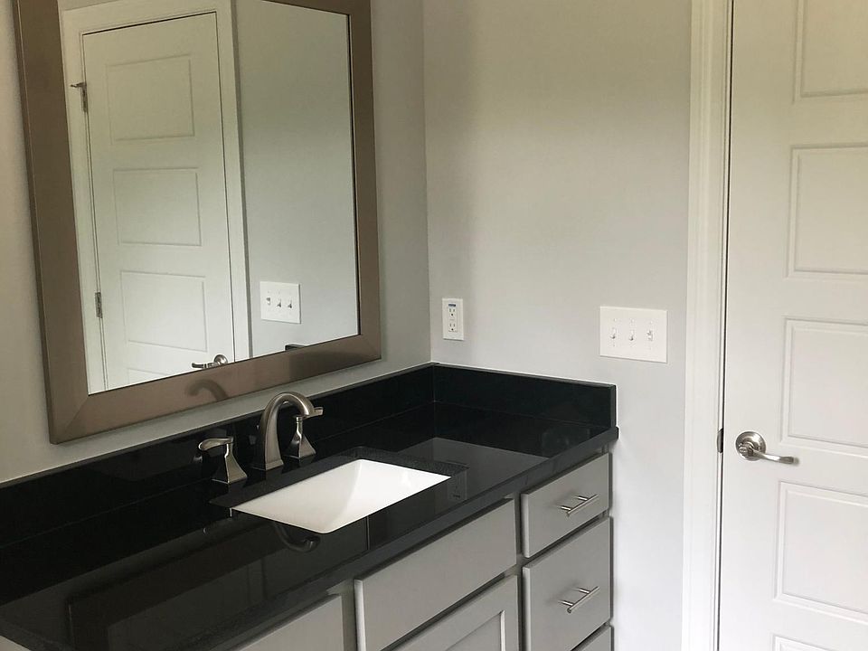 Granite countertop and decorative tile in bathroom