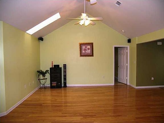 Living Room with Smooth Texture Cathedral Ceiling