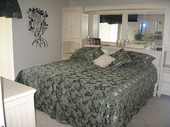 master  br has 2 walk in closets and direct lake views