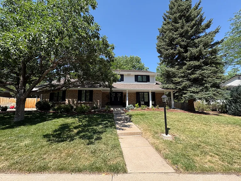 5769 S Geneva St — Photo 2