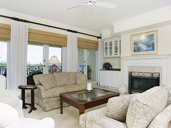 Living room with firplace overlooking the river