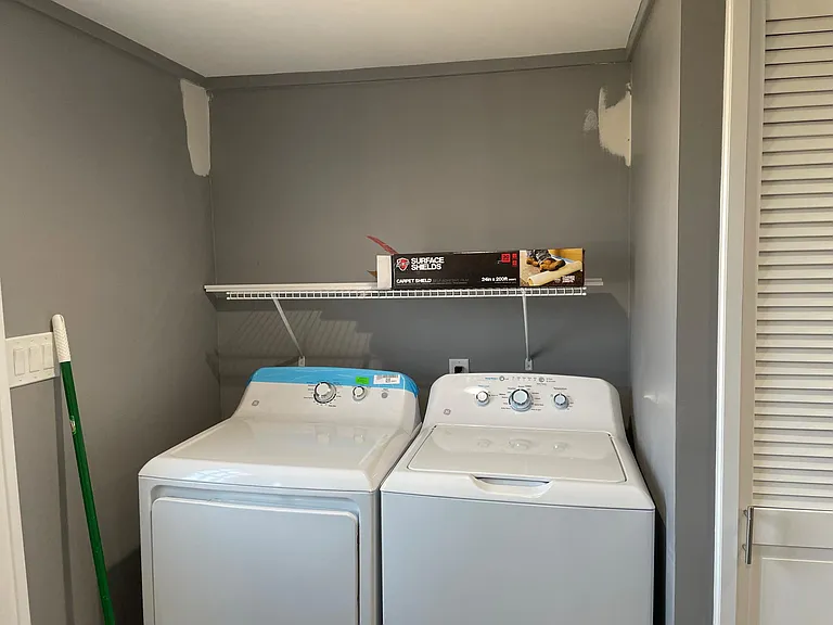Washer and dryer in nook off kitchen (painting will be completed before move in)