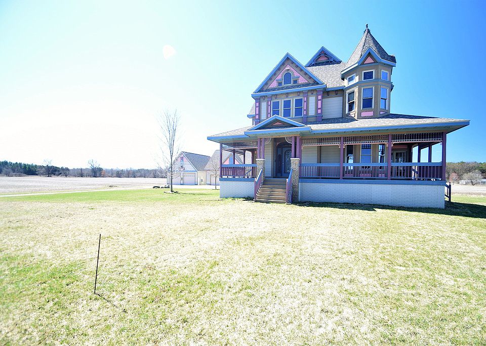 Step back in time in this stunning Victorian-style home that offers every modern convenience you could think of, and more! With just under 4,000 square feet of living space, this magnificent home also offers a fully-finished walk-out basement, a two-tiered outdoor deck, sun room, wrap-around porch - the list goes on! The elegance of this home is evident in every room, with hardwood floors and ornate woodwork throughout, two fireplaces, formal living and dining areas, and even a spiral staircase. Located on 5 acres, (2.5 acres have been added!) this home also offers an attached garage, and 2 considerable outbuildings, both with loft space. Just outside of Freeland, this home offers luxury in the country while being just a short commute to any of the Tri-City areas!