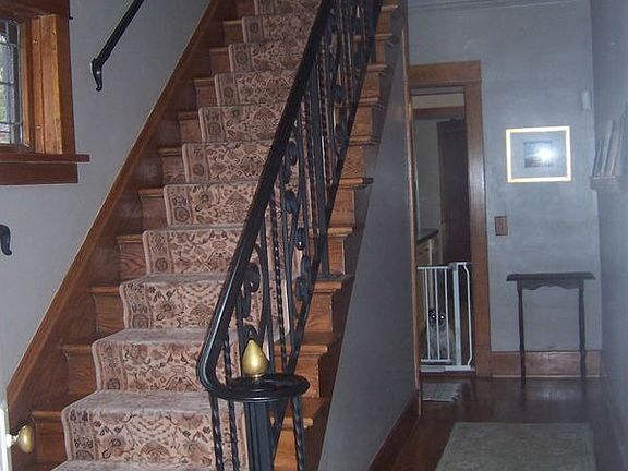 chestnut staircase with runner