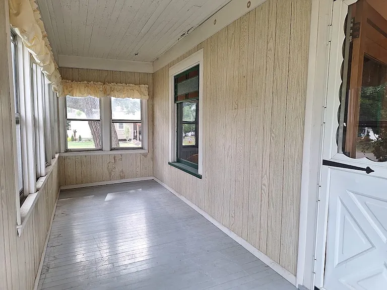 enclosed front hall, with storm windows and screens