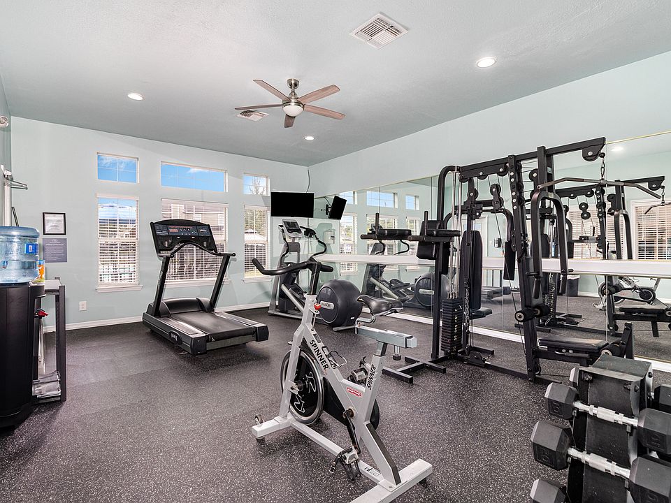 Keep up with your fitness goals in our fully equipped home gym, featuring a variety of exercise machines.