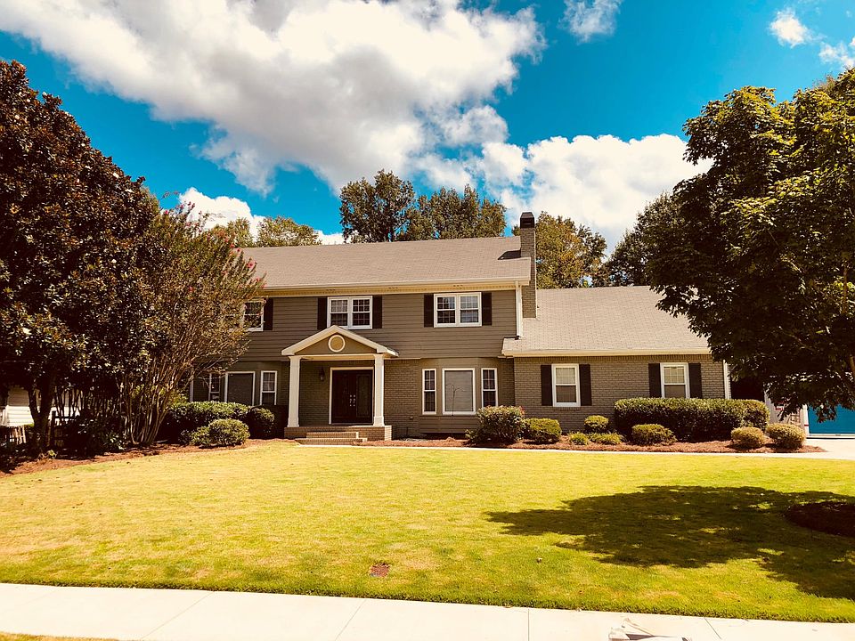4757 Olde Village Lane - Front. Backyard features a deck overlooking natural woods. Deer are frequent visitors. Fenced back yard