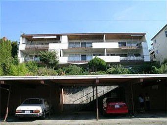 Back of the building showing the covered parking. Storage units are on the left of the parking.