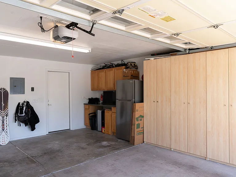 2 car garage with storage and fridge