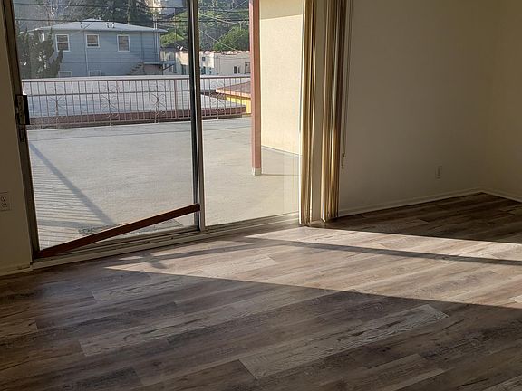 LIVING ROOM LOOKING OUT ONTO THE BALCONY