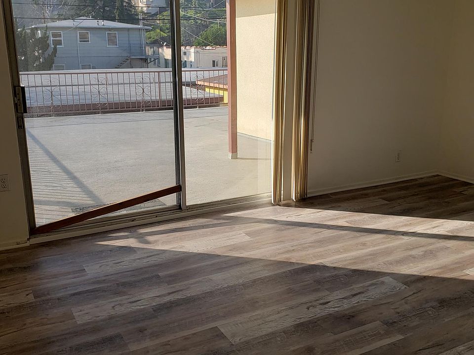 LIVING ROOM LOOKING OUT ONTO THE BALCONY