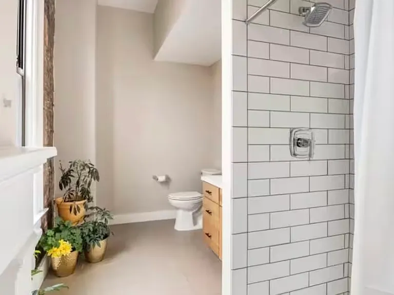 First floor full bathroom with with a sleek walk-in shower