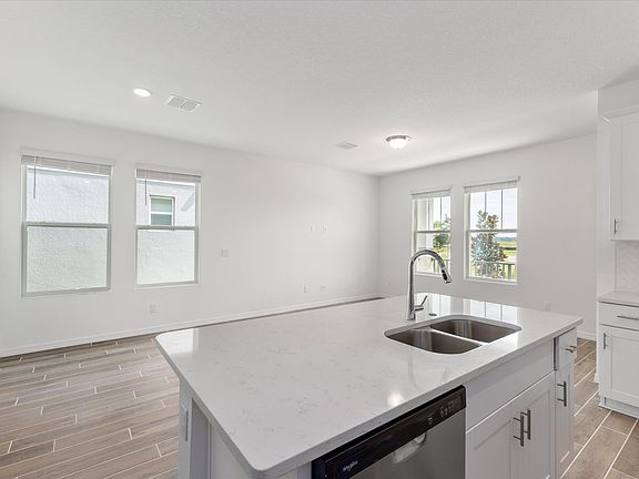 Kitchen in the Austen floorplan at 4625 Cross Prairie Parkway in The Meadow at Crossprairie
