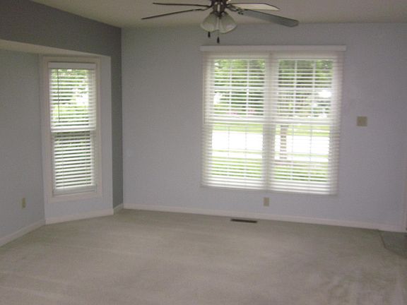 Living room with bay windows