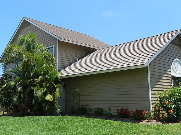 Side of home from street with lake view