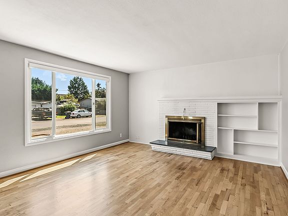 living room with fireplace and built in's