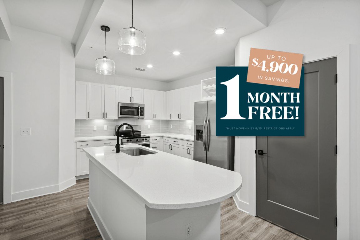 Kitchen with Quartz Countertop and Stainless Steel Appliances