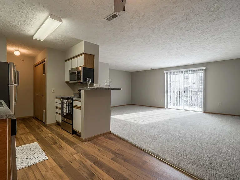 Open sightlines between the kitchen and living room help every gathering feel more connected.