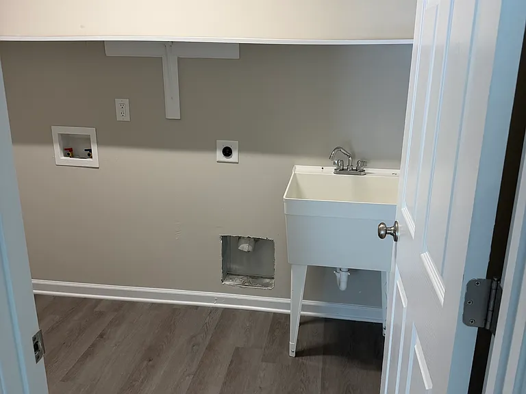 laundry room with tub sink