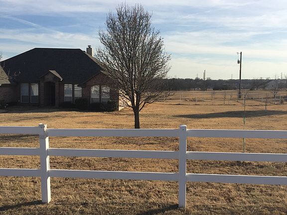 white vinyl fence along road