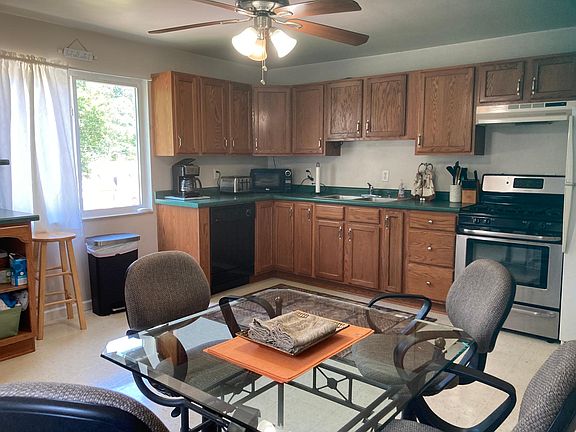 NiceLarge Kitchen. Lots of cabinets. Gas stove. Large refrigerator. Glass top table with comfortable roller chairs.