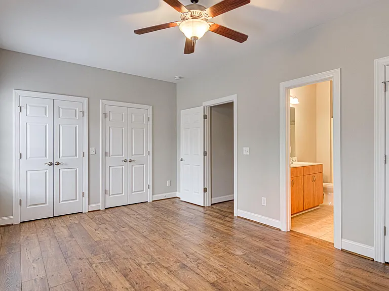 Three Closets to Master Bedroom with Ceiling Fan and Light