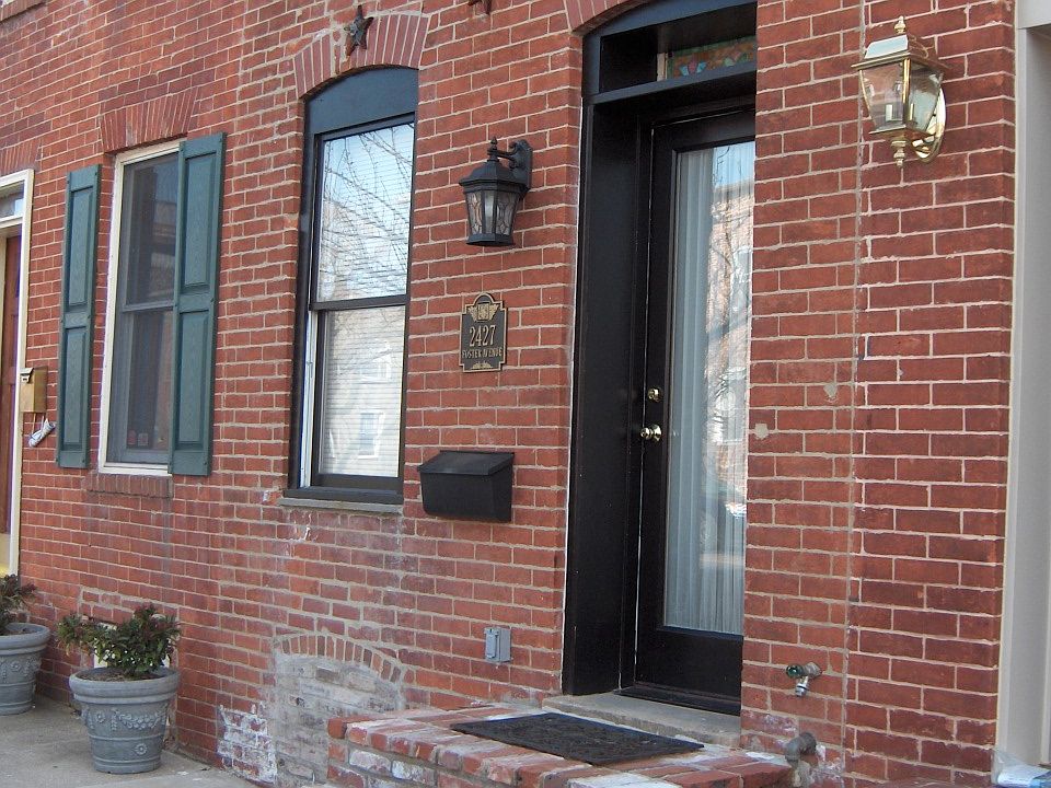 Front landing constructed of original 'salmon' brick repurposed from renovation.