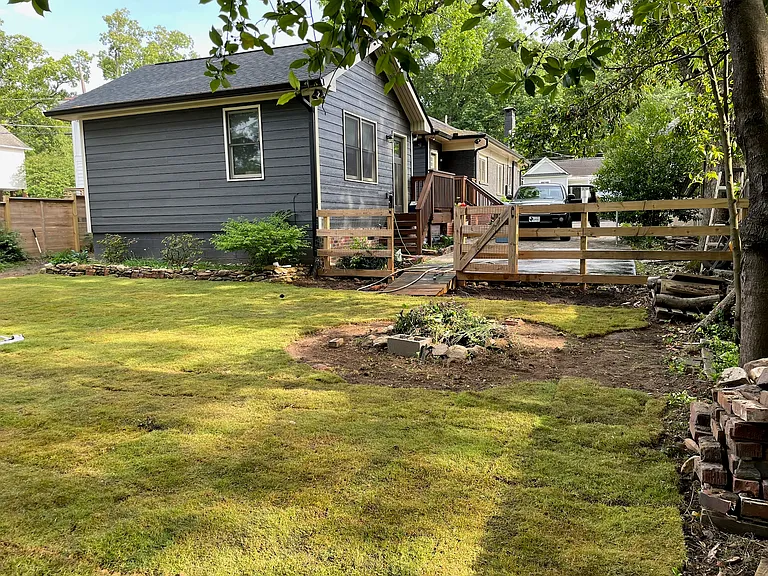 Backyard view back to house and parking easment