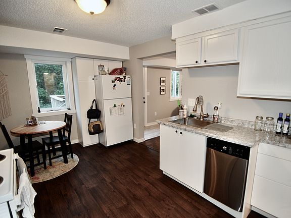 IKEA lower cabinetry and surrounding refrigerator.