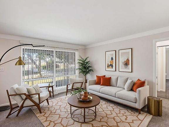 Living Room *House is unfurnished and virtually staged to show possibilities. Lights, Window Treatments, Wall/Ceiling Colors, Cabinet/Countertop Colors and Flooring are Accurate.*