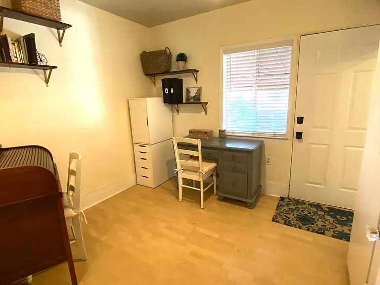 Bedroom 2: Door leads to back deck. Bathroom and built in closet to the right.