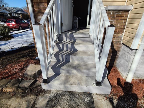 Front Entry into Mud Room (concrete steps will be dark gray epoxy before move in)