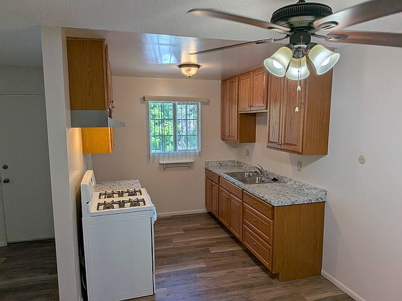Kitchen with new cabinets, countertop & flooring