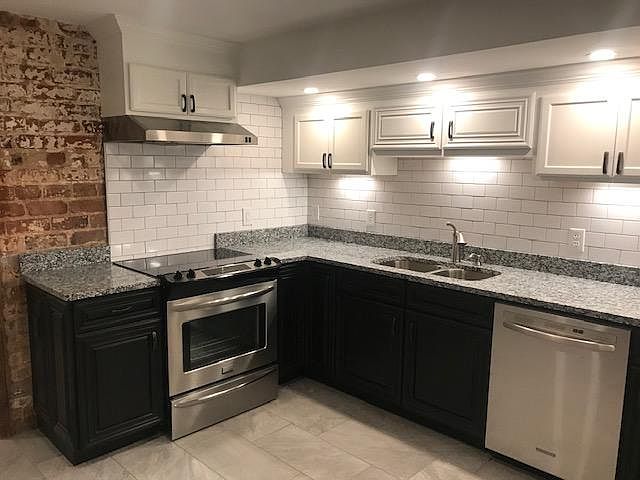 New Kitchen has Dishwasher, stainless appliances and granite countertop.